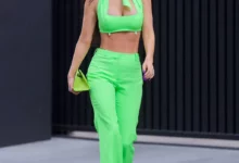 Megan Fox wears neon green for Machine Gun Kelly's concert.